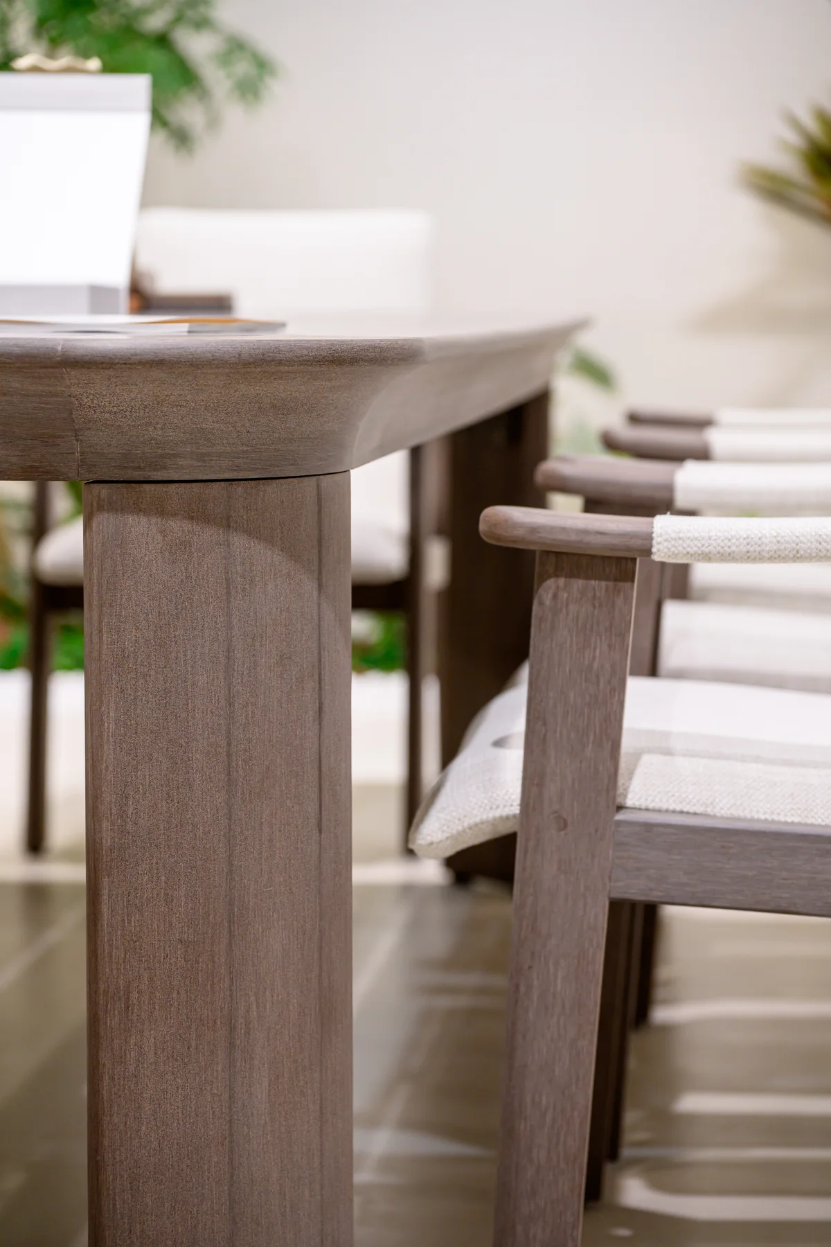 Table edge and upholstered chairs displayed together