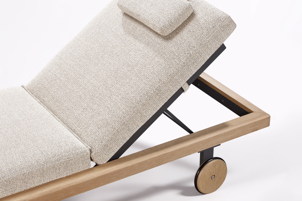Adjustable outdoor lounger showing its frame, support mechanism and wheel detail.