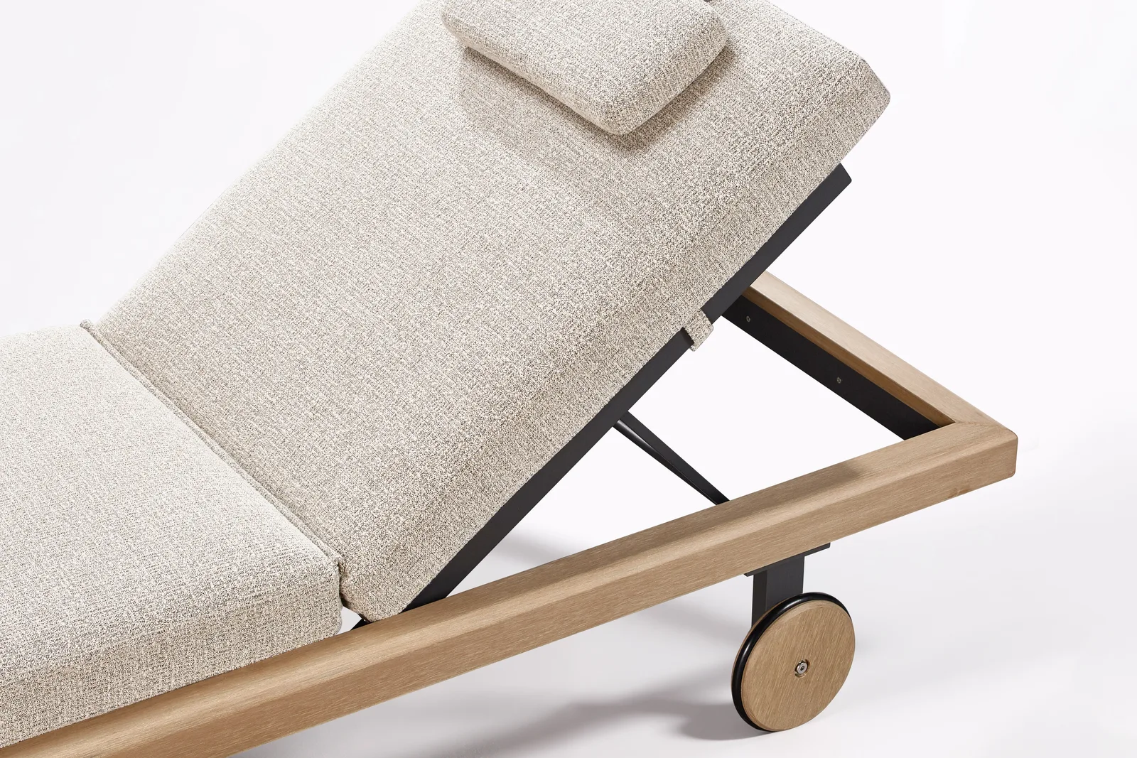 Lounger frame with a visible wheel beside the upholstered back support