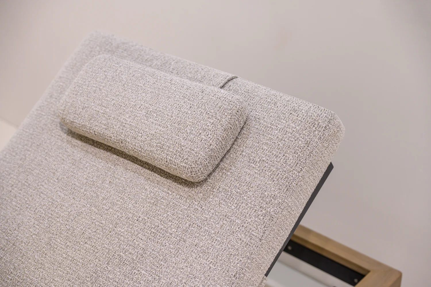 Textured lounger cushion and a separate padded headrest