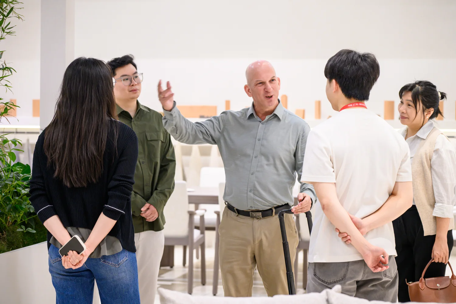 Five visitors in a discussion at the Sumparwood exhibition