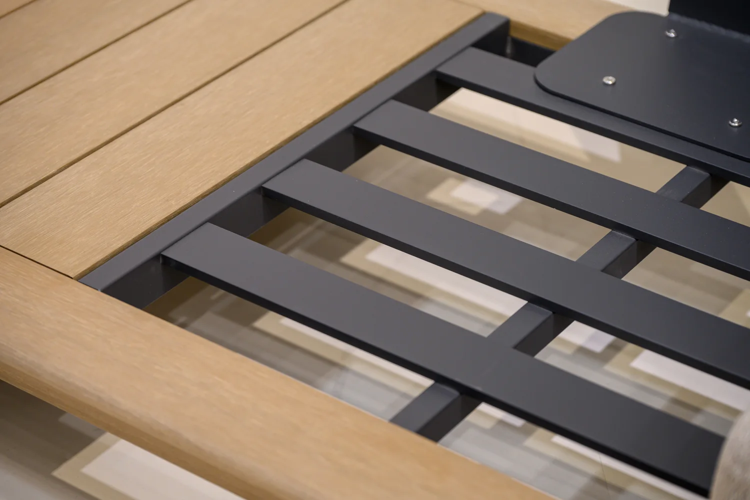 Open seat frame with spaced dark support rails and visible attachment points