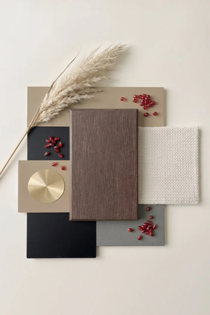 Black Walnut Sumparwood pairing board with cream fabric, charcoal surfaces and brushed brass