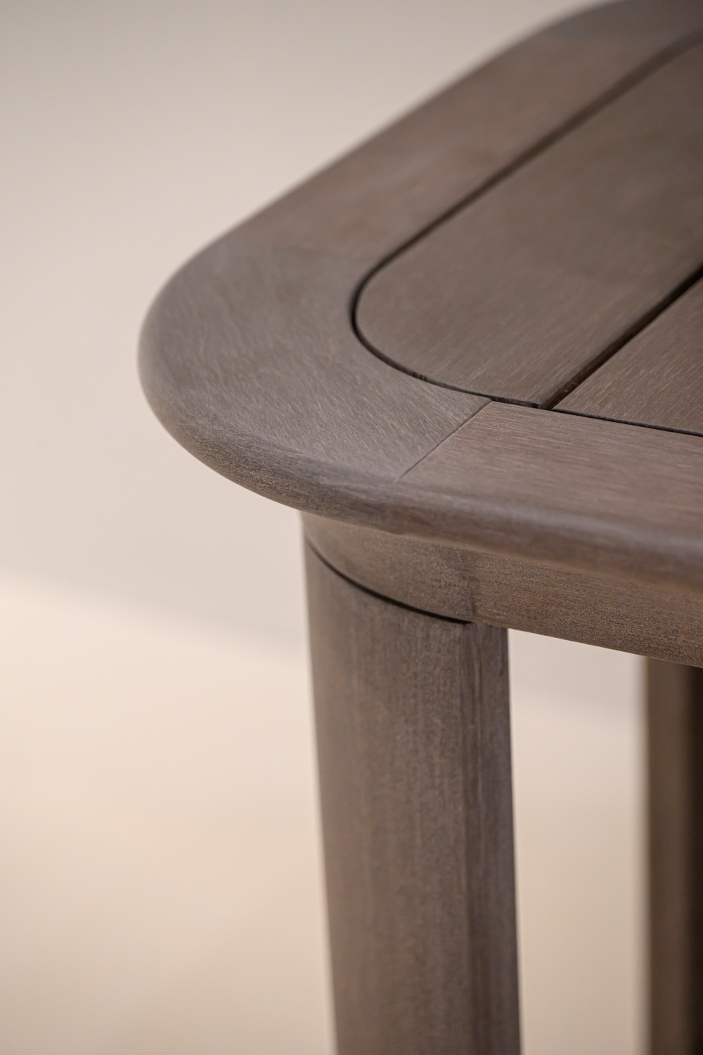 Rounded brown table edge meeting a leg at the Sumparwood exhibition
